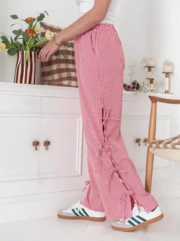 Levoire | Mode dames pantalons carotte avec motif à carreaux et bretelles
