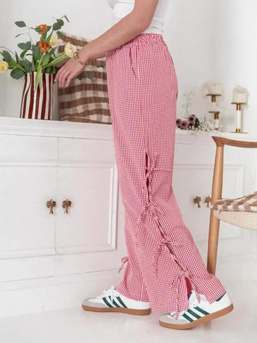 Levoire | Mode dames pantalons carotte avec motif à carreaux et bretelles
