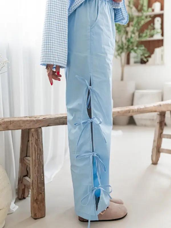 Levoire | Mode dames pantalons carotte avec motif à carreaux et bretelles