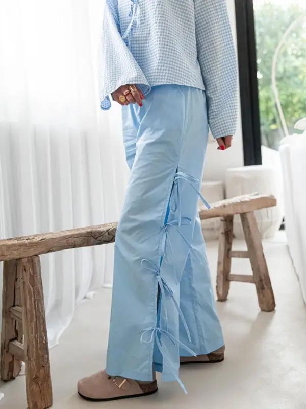 Levoire | Mode dames pantalons carotte avec motif à carreaux et bretelles