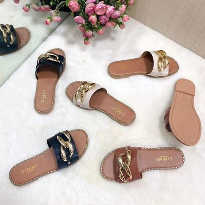 Levoire | Chaussons avec design boucle dorée